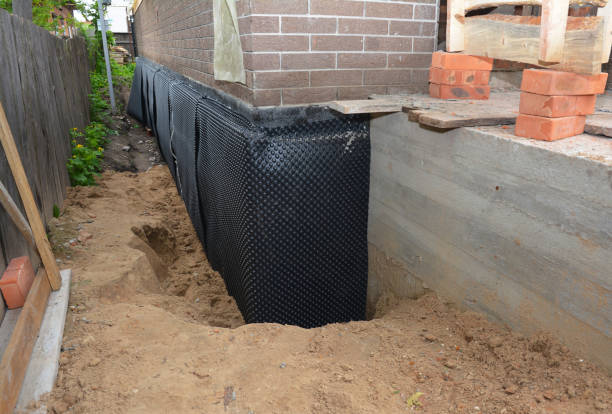 SJ Waterproofing Pros technician performing targeted Waterproofing assessment in North Bend, OH